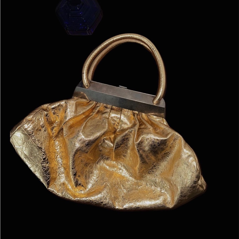 Sonia Rykiel Top Handle Bag
Gold Leather / Silver-Tone Hardware
One of the kind